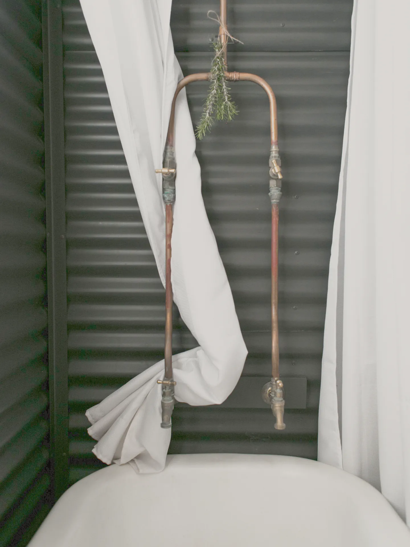 Copper taps over a clawfoot bath