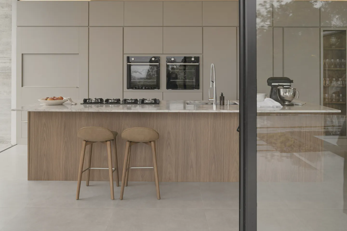 The island bench with stools and appliances