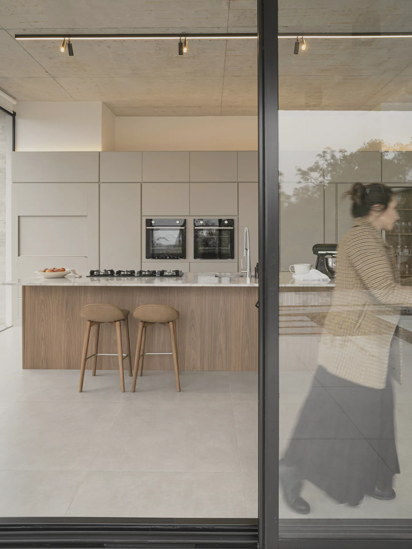 The kitchen’s walnut island and the butler’s wall