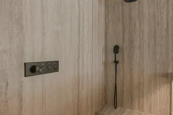 The shower bench and its lit linear drain