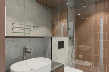 The apartment bathroom’s basin, pan and shower
