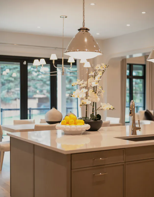 An island sink under pendant lights