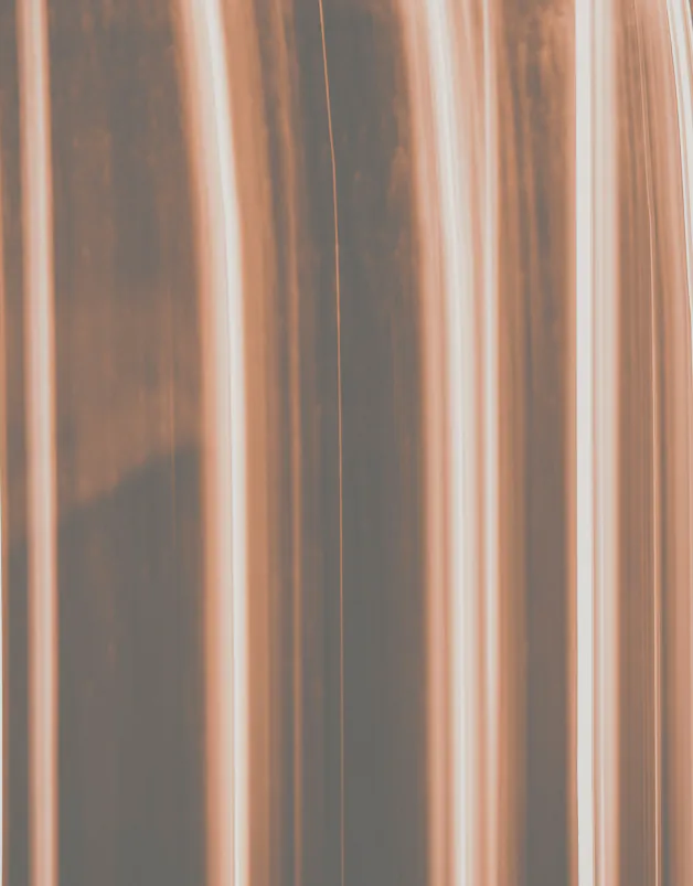 Two copper pipes side by side