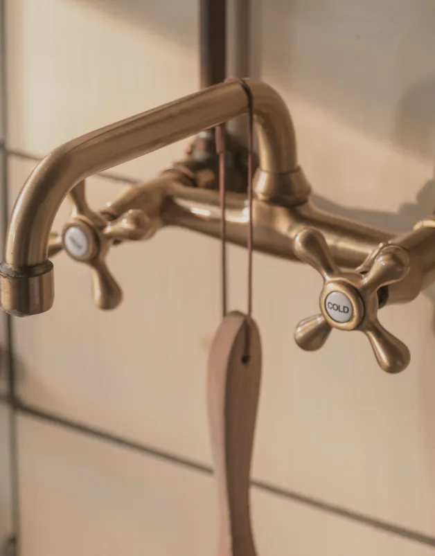 A brass tap on its copper pipe