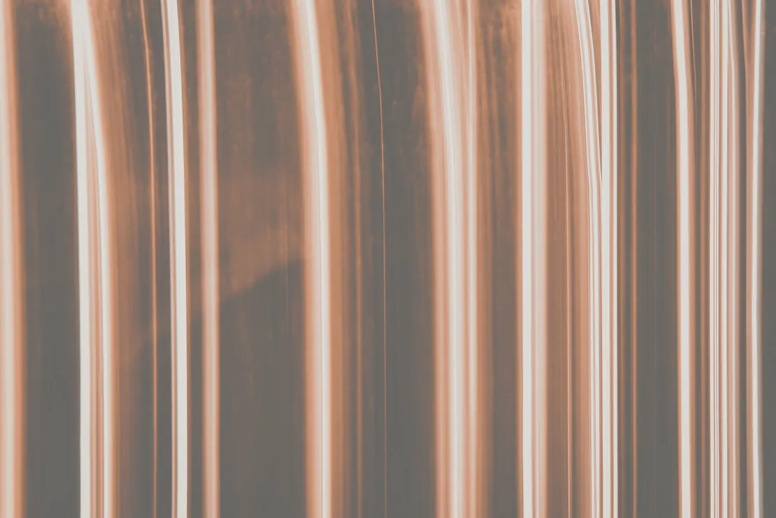 Two copper pipes run side by side