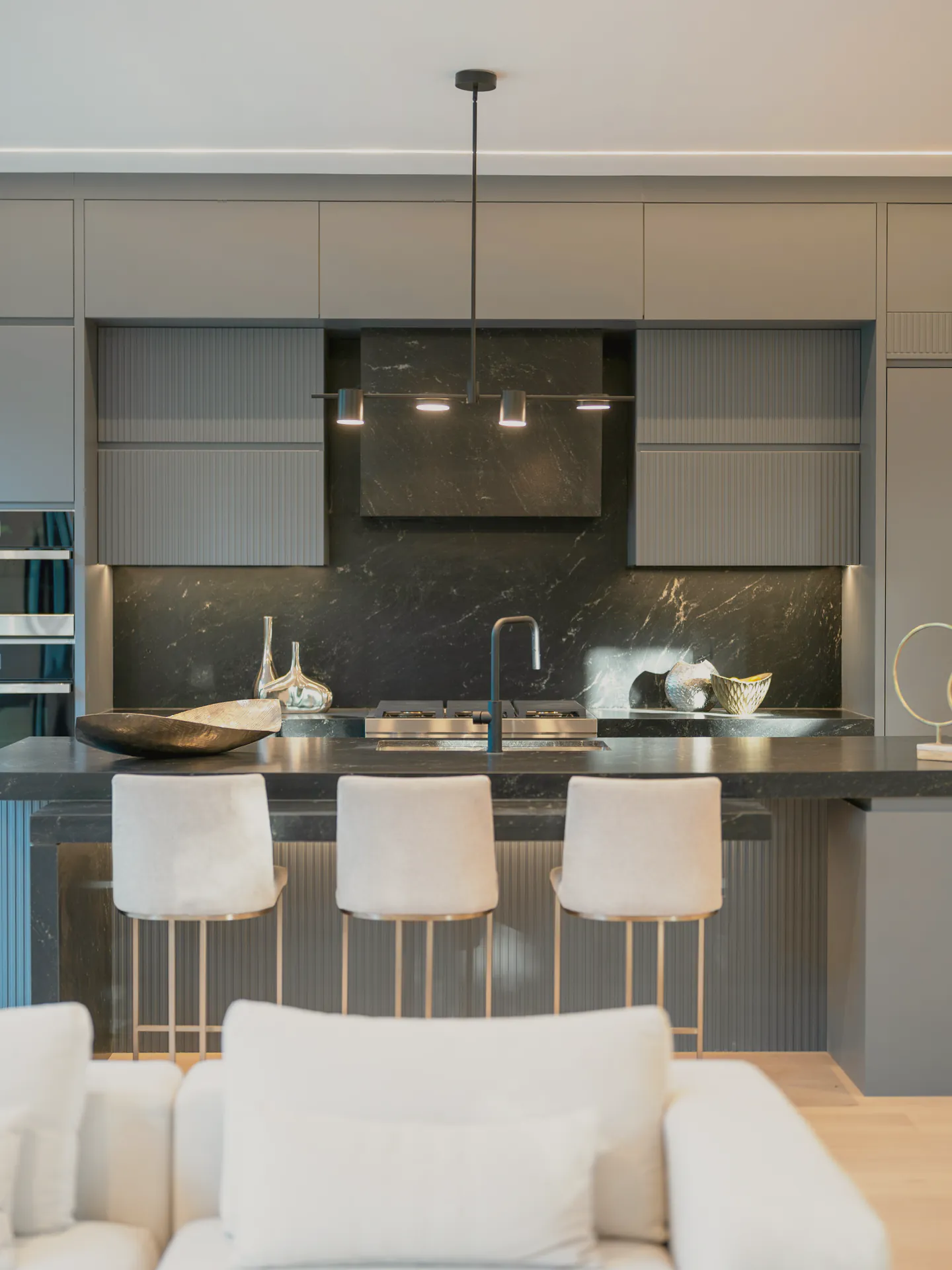 The kitchen island with stools